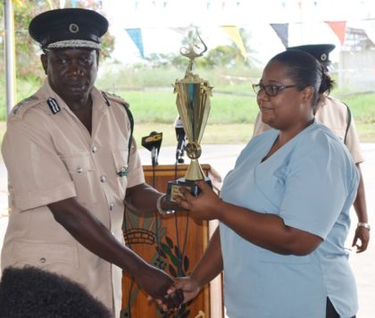 Best Graduating Prison Officer WPO#3469 Rodlyn Jack receiving a trophy at the graduation ceremony held at the Cecil Kilkenny Prison Officers’ Training School, Lusignan 