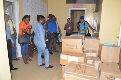Minister of Public Health, Dr. George Norton briefing his team before distribution and delivery of drugs to health facilities in Region One 