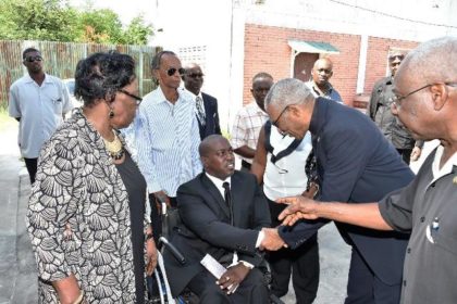 President David Granger expressing his condolences to Mr. Kenwyn Carmichael, the son of the late Mr. Fitz Carmichael at the St. James The-Less Anglican Church 