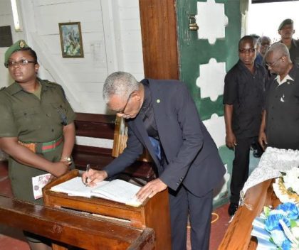 President David Granger signing the Book of Condolence at the church 