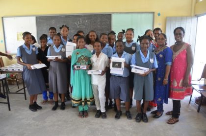 Some of the Grade 7 Students of the Diamond Secondary School with their tablets