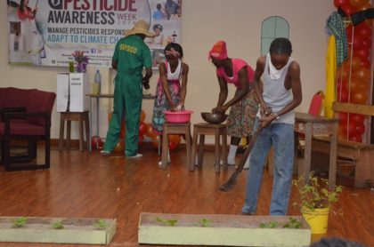 Students dramatizing the improper handling and effects of pesticides and toxic chemicals on human health and the environment at the PTCCB drama competition finals at the Ramada Princess