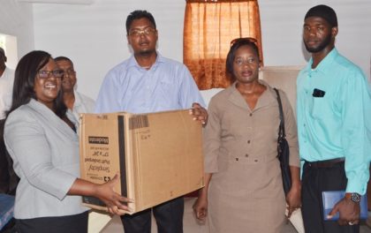 Minister within the Ministry of Public Health, Dr. Karen Cummings hands over medical supplies to Doctor in Charge of Wakenaam Cottage Hospital, in the presence of Director of Regional Health Services, Dr. Kay Shako and Regional Health Officer Region Three Dr. Naail Uhtman