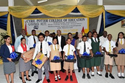 President David Granger with teachers and students, who received laptops at the launch of the One Laptop Per Teacher (OLPT) initiative 