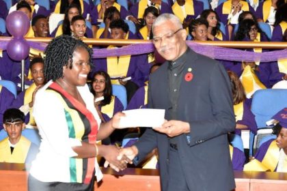 President David Granger presents a cheque for $1M to the Head Teacher of President’s College, Ms. Carlyn Canterbury, for the development of the school’s science and technology facilities.