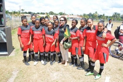 Students of the Kwakwani Football Club were excited to have their photograph taken with First Lady, Mrs. Sandra Granger.