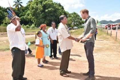 Prince Harry arrives at Surama Village and is greeted by Minister of Indigenous Peoples' Affairs,  Sydney Allicock.