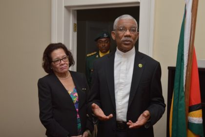 President David Granger addressing the staff of Guyana's Consulate in Barbados as First Lady. Mrs. Sandra Granger listens intently