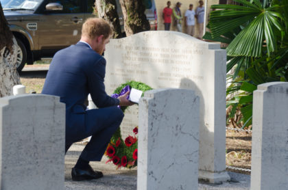 Prince Harry lays a wreath at the Commonwealth War memorial graves